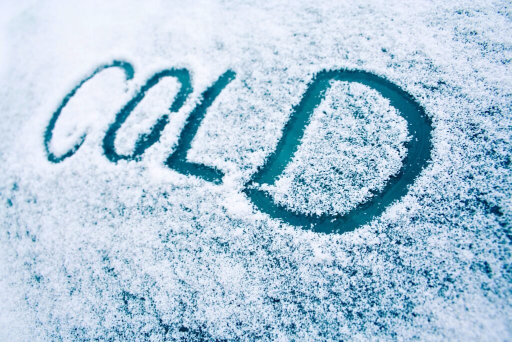 Description "Cold" drawn in the snow.