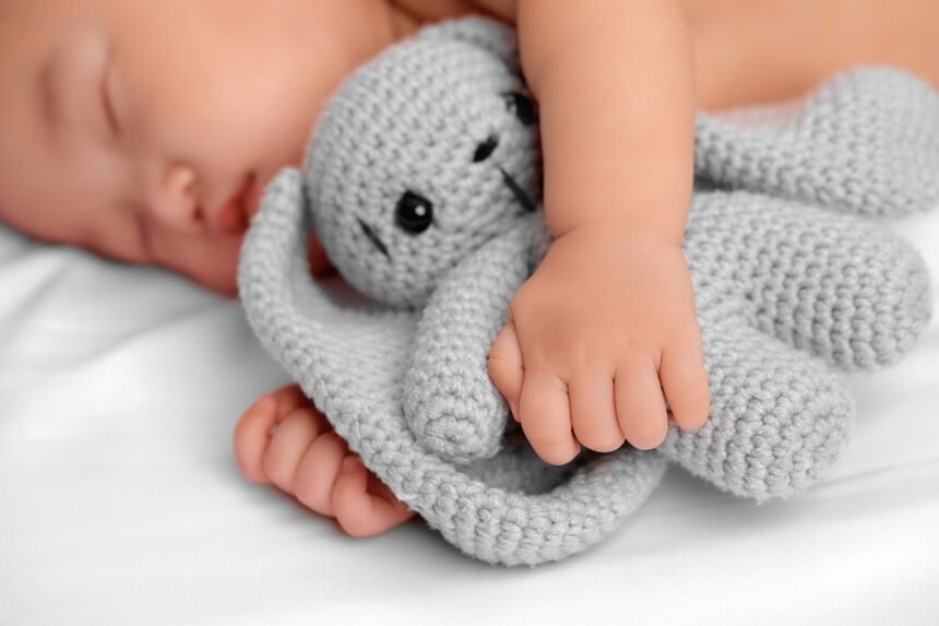 Small baby with toy