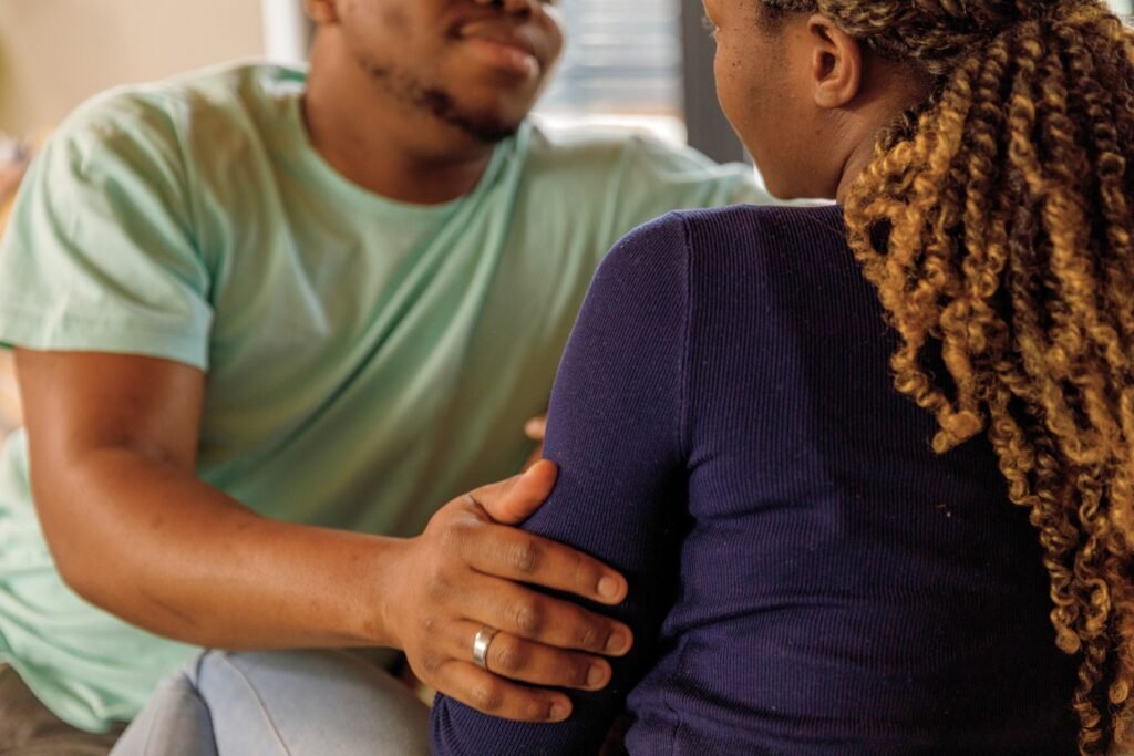 A father provides emotional support to his daughter